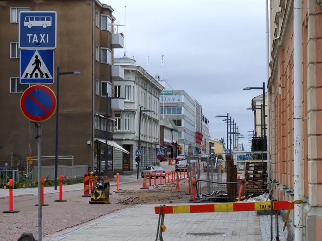 The image shows a city street with buildings, street poles, street lights, sign boards, traffic...