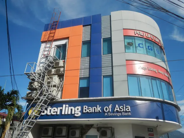 The image shows the Sterling Bank of Asia in Manila, Philippines. It is a building with windows,...