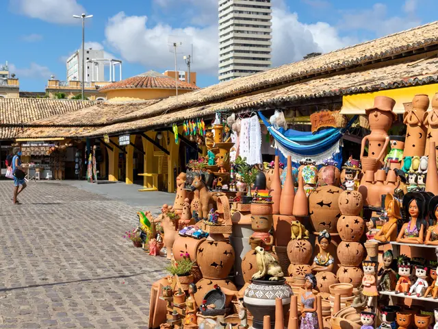 The image shows a bustling market in Cartagena, Colombia, with a variety of items for sale,...