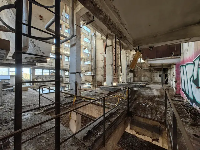 The image shows an abandoned building with graffiti on the walls. Inside the building, there are...