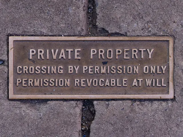 The image shows a plaque on the sidewalk that reads "Private Property Crossing by Permission Only"....
