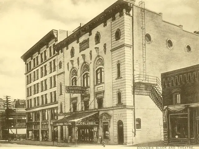 The image shows an old building on the corner of a street, with windows, name boards, electric...