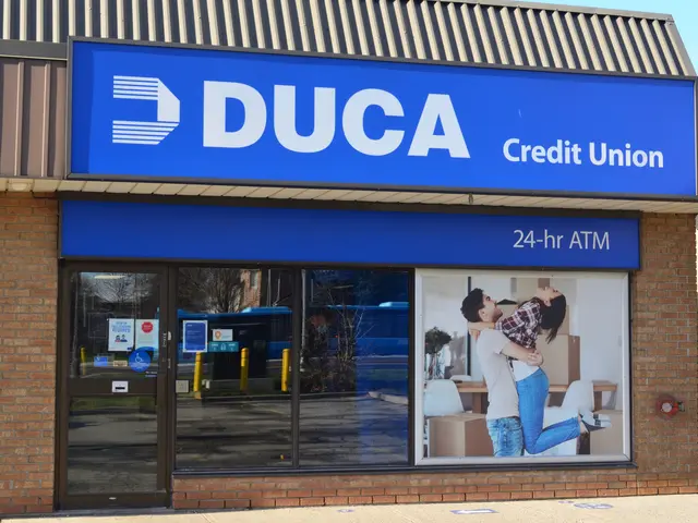 The image shows a building with glass walls and doors, a board with text and a picture of a man and...