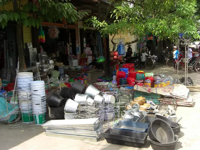 The image shows a street market with a variety of items on display, including utensils, plates,...