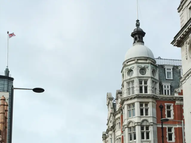 The image shows a bustling city street with a red double decker bus driving down it, surrounded by...