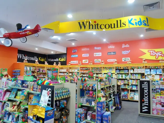 The image shows a store filled with lots of toys and other items arranged in racks. At the top of...