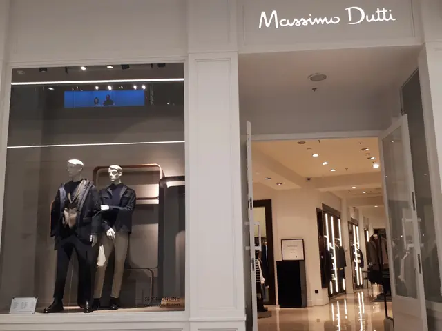 The image shows a Massimo Dutti store in Milan, Italy. Inside the store, there are mannequins...