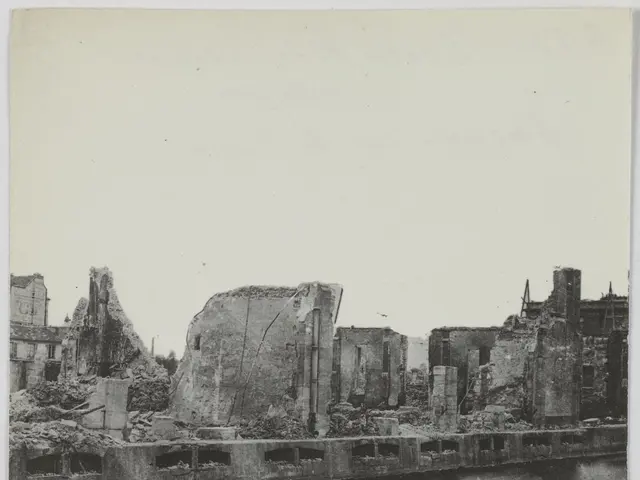 The image shows a black and white photo of the ruins of a building, with the water in the...