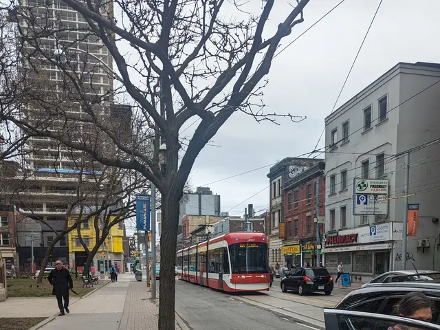 The image shows a woman getting out of a car on a city street, with a tram in the background. The...