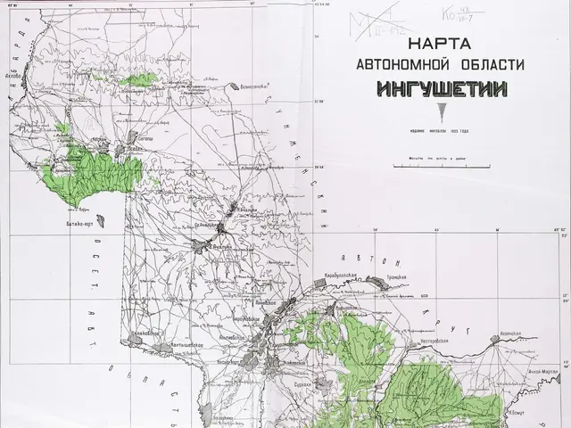 The image shows a topographic map of the Russian Federation on a wooden surface. The map is...